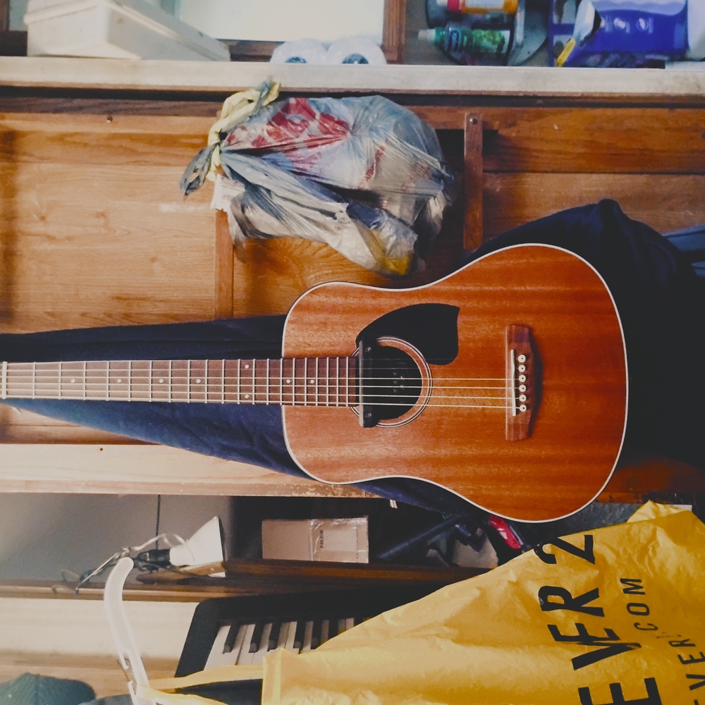 Classic Brown Acoustic Guitar with Dreadnought Body and Solid Wood Top